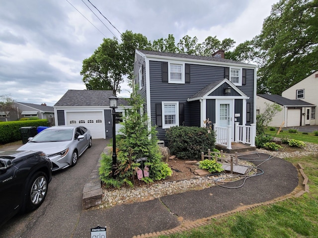 1437 Silver Ln, East Hartford, CT 06118 - colonial inspired home with a chimney, asphalt driveway, and an outdoor structure