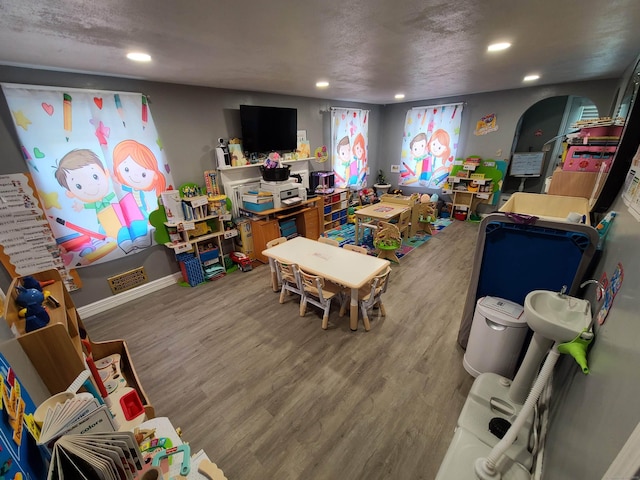 1437 Silver Ln, East Hartford, CT 06118 - playroom with recessed lighting and wood finished floors