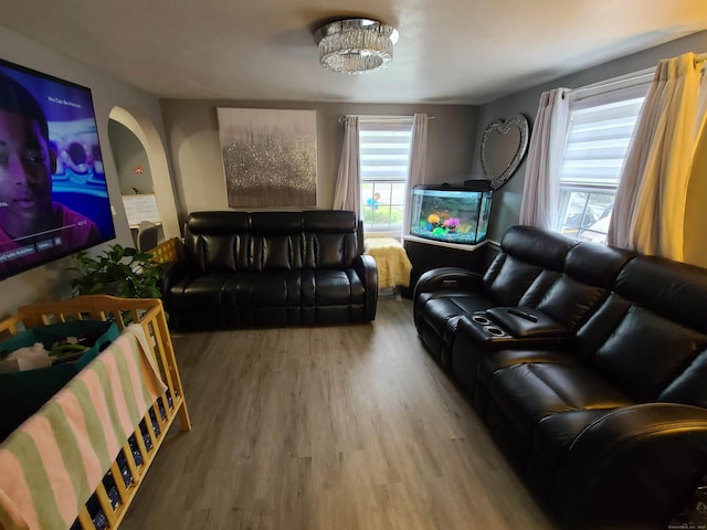 1437 Silver Ln, East Hartford, CT 06118 - living area featuring wood finished floors and arched walkways
