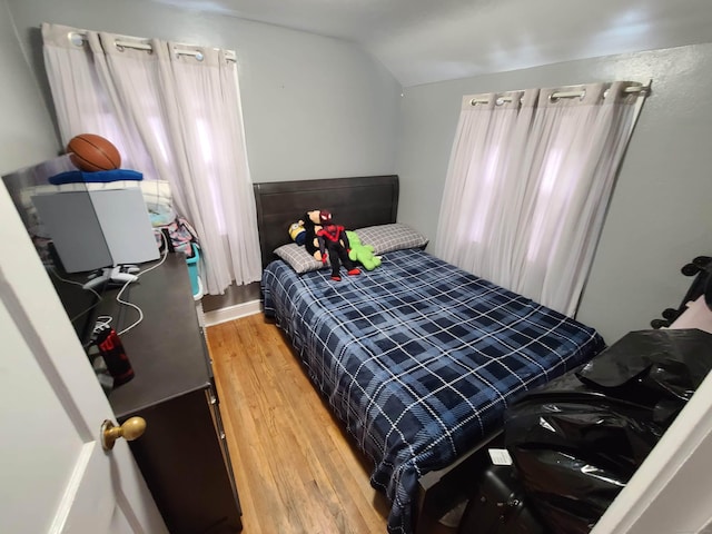 1437 Silver Ln, East Hartford, CT 06118 - bedroom featuring lofted ceiling and light wood-style flooring