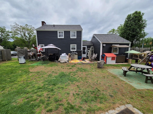 1437 Silver Ln, East Hartford, CT 06118 - rear view of house featuring a chimney and a shingled roof