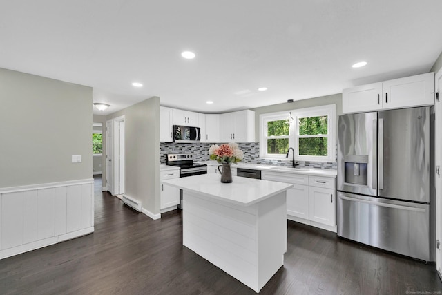 2 Broken Arrow Dr, East Granby, CT 06026 - kitchen featuring appliances with stainless steel finishes, a sink, light countertops, white cabinets, and backsplash