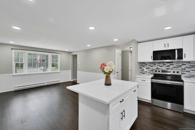 2 Broken Arrow Dr, East Granby, CT 06026 - kitchen featuring appliances with stainless steel finishes, baseboard heating, light countertops, wainscoting, and a kitchen island