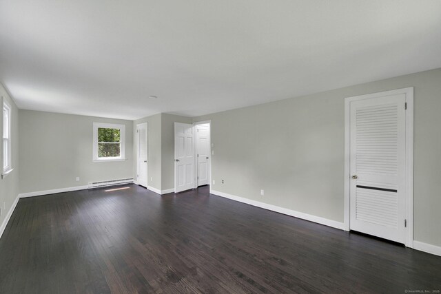 2 Broken Arrow Dr, East Granby, CT 06026 - empty room with a baseboard radiator, baseboards, and dark wood-style flooring