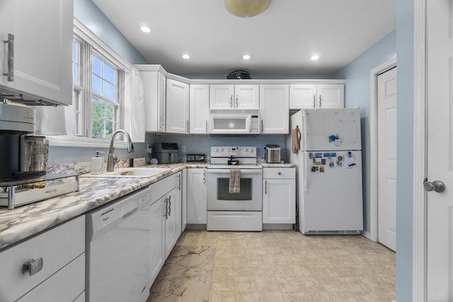 75 Redwood Dr Unit 1302, East Haven, CT 06513 - kitchen with white appliances, a sink, white cabinetry, recessed lighting, and light stone counters