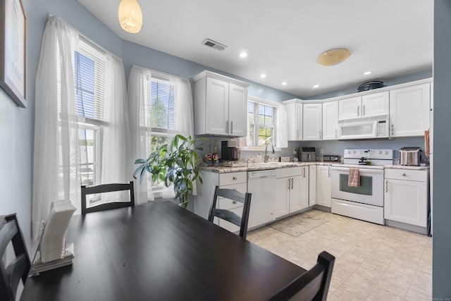 75 Redwood Dr Unit 1302, East Haven, CT 06513 - kitchen featuring white appliances, white cabinets, a sink, and recessed lighting