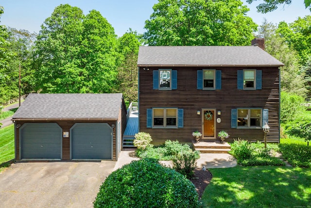 113 Toddy Hill Rd, Newtown, CT 06482 - view of front of home with an outbuilding, a chimney, a detached garage, and a shingled roof
