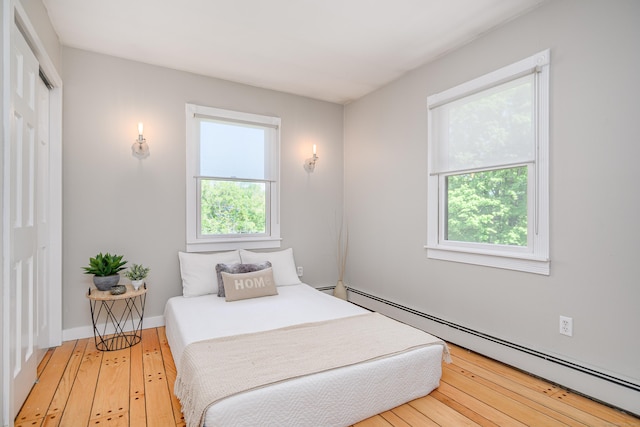 113 Toddy Hill Rd, Newtown, CT 06482 - bedroom with a baseboard radiator and hardwood / wood-style floors