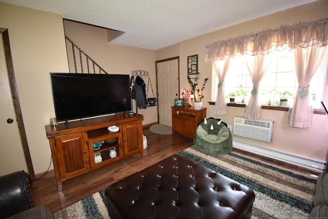143 Pine Hill Rd Unit 8B, Thomaston, CT 06787 - living area with wood finished floors, a wall mounted AC, a baseboard radiator, and stairway