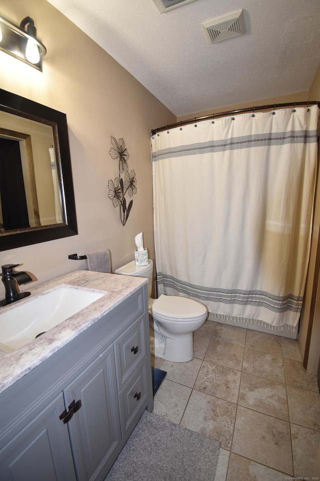 143 Pine Hill Rd Unit 8B, Thomaston, CT 06787 - full bath featuring vanity, toilet, and a textured ceiling