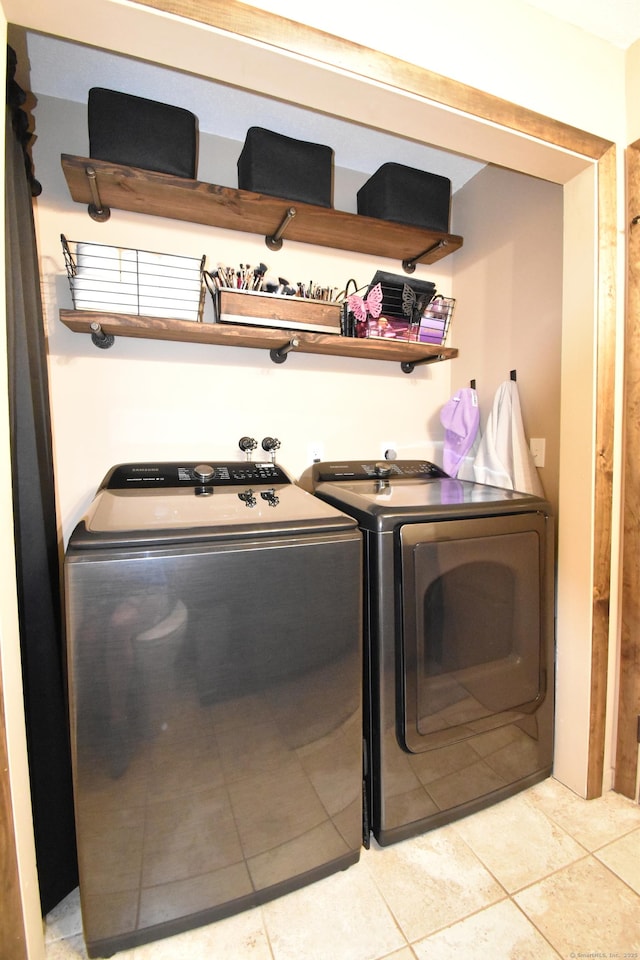 143 Pine Hill Rd Unit 8B, Thomaston, CT 06787 - washroom featuring washer and clothes dryer and light tile patterned flooring