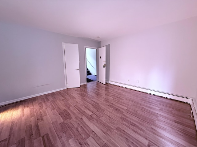 1105 Waterbury Rd Apt 1B, Cheshire, CT 06410 - unfurnished room featuring a baseboard radiator and wood finished floors