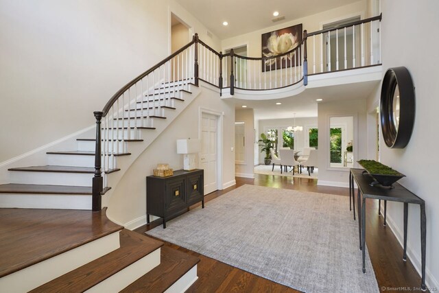7 Sherwood Farms Ln, Westport, CT 06880 - entrance foyer featuring stairway, wood finished floors, a chandelier, a high ceiling, and recessed lighting