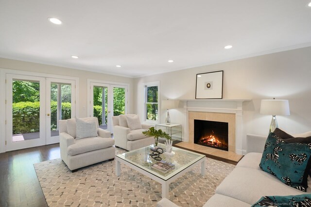 7 Sherwood Farms Ln, Westport, CT 06880 - living area featuring plenty of natural light, a tile fireplace, recessed lighting, crown molding, and wood finished floors