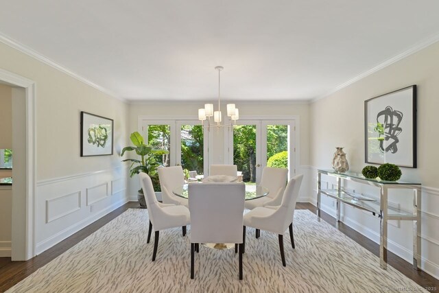 7 Sherwood Farms Ln, Westport, CT 06880 - dining room featuring french doors, wood finished floors, ornamental molding, a chandelier, and a wainscoted wall