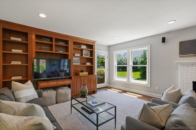 7 Sherwood Farms Ln, Westport, CT 06880 - living room with baseboards, recessed lighting, light wood-style floors, and a fireplace