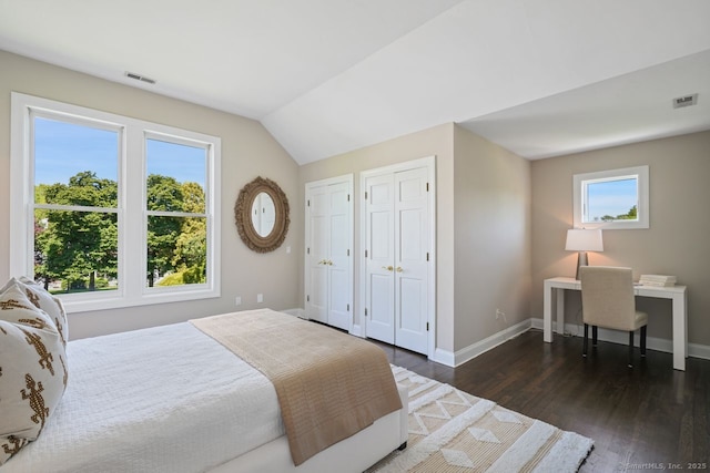 7 Sherwood Farms Ln, Westport, CT 06880 - bedroom with two closets, dark wood-type flooring, baseboards, vaulted ceiling, and a desk