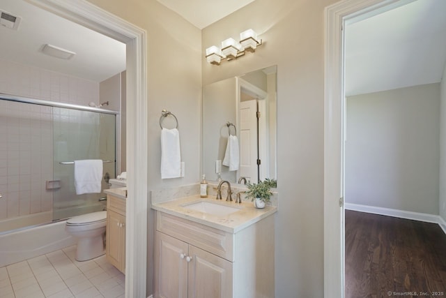 7 Sherwood Farms Ln, Westport, CT 06880 - full bath featuring vanity, combined bath / shower with glass door, toilet, and tile patterned flooring