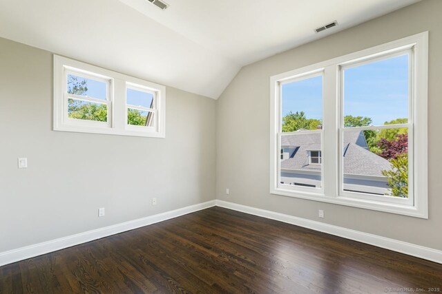 7 Sherwood Farms Ln, Westport, CT 06880 - bonus room with baseboards, vaulted ceiling, and dark wood-type flooring