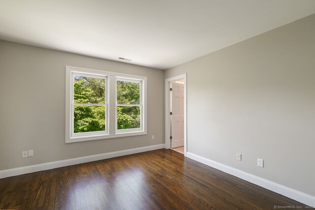 7 Sherwood Farms Ln, Westport, CT 06880 - spare room featuring baseboards and dark wood-style floors
