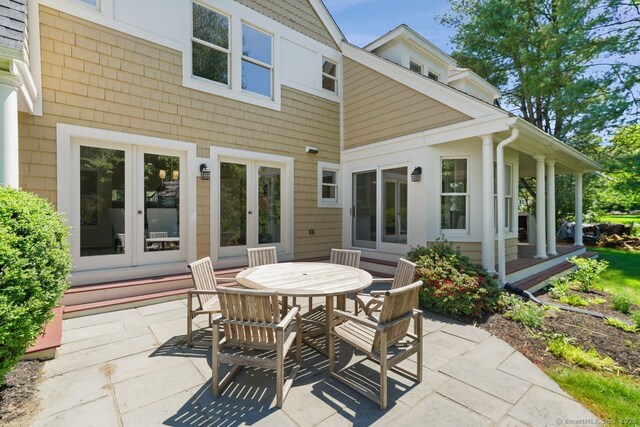 7 Sherwood Farms Ln, Westport, CT 06880 - view of patio featuring french doors and outdoor dining space