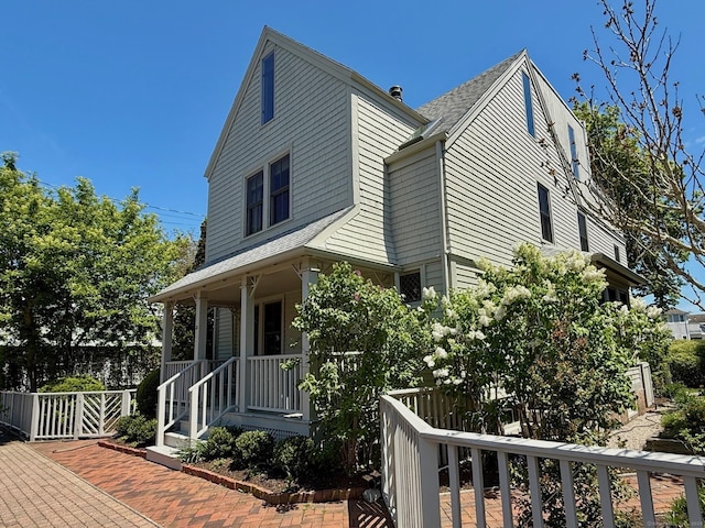 37 Orchard St, Stonington, CT 06378 - view of property exterior with a porch and a shingled roof