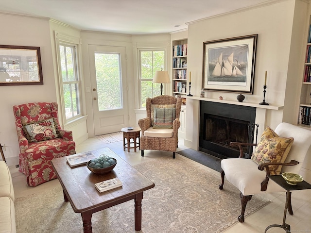 37 Orchard St, Stonington, CT 06378 - living area featuring a fireplace with flush hearth, ornamental molding, and built in features