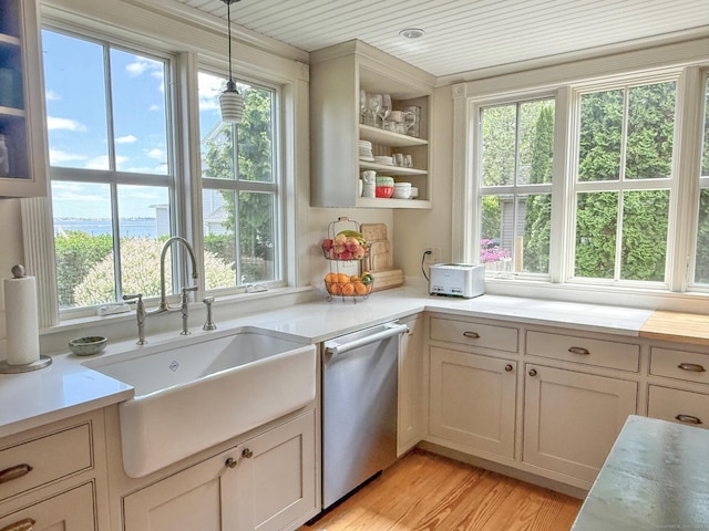 37 Orchard St, Stonington, CT 06378 - kitchen with dishwasher, a sink, light countertops, and plenty of natural light