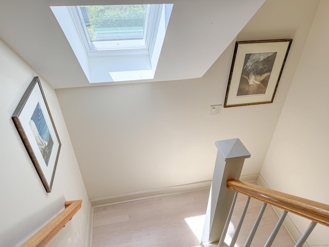 37 Orchard St, Stonington, CT 06378 - stairs featuring a skylight, wood finished floors, and baseboards