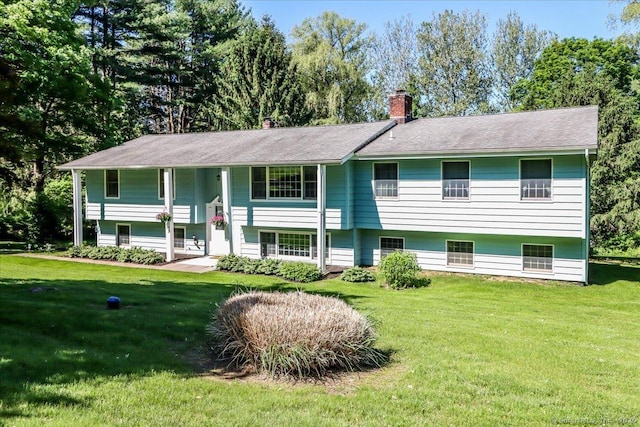 8 Prospect Ct, Brookfield, CT 06804 - split foyer home with a chimney and a front yard