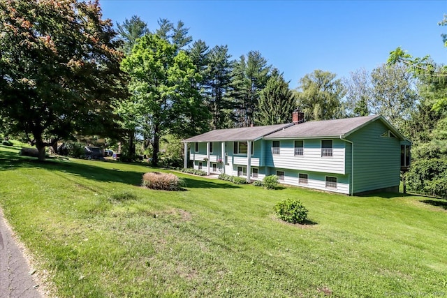 8 Prospect Ct, Brookfield, CT 06804 - split foyer home featuring a front lawn and a chimney
