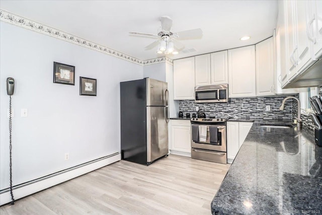 8 Prospect Ct, Brookfield, CT 06804 - kitchen featuring stainless steel appliances, baseboard heating, a sink, light wood-style flooring, and white cabinetry