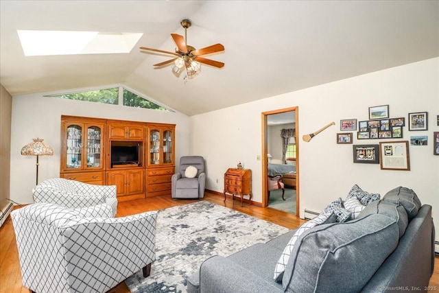 8 Prospect Ct, Brookfield, CT 06804 - living area with a skylight, light wood finished floors, ceiling fan, vaulted ceiling, and a baseboard radiator