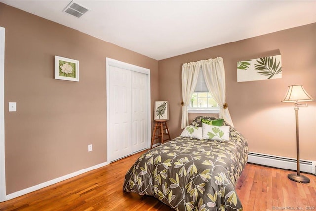 8 Prospect Ct, Brookfield, CT 06804 - bedroom featuring a baseboard radiator, wood finished floors, baseboards, and a closet