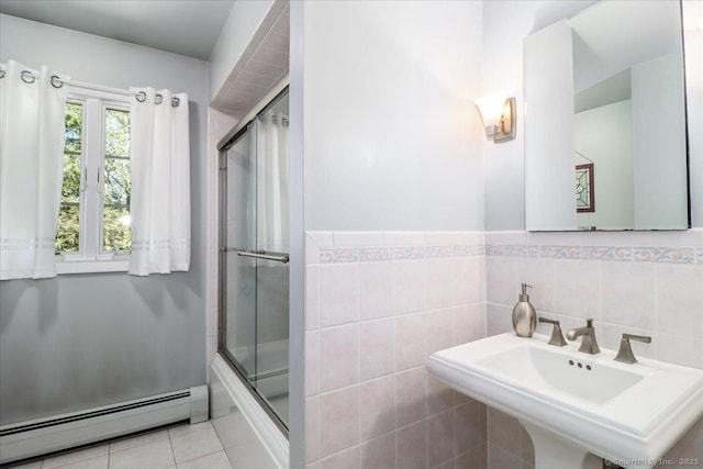 8 Prospect Ct, Brookfield, CT 06804 - bathroom featuring a baseboard radiator, a sink, tile patterned floors, shower / bath combination with glass door, and a wainscoted wall