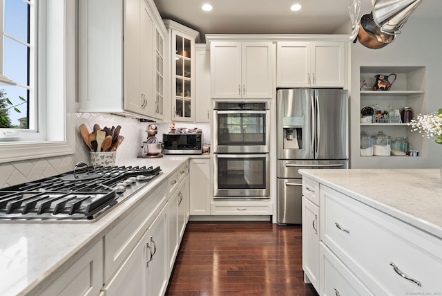 100 Pembroke Ter, Glastonbury, CT 06033 - kitchen featuring appliances with stainless steel finishes, recessed lighting, white cabinetry, and tasteful backsplash