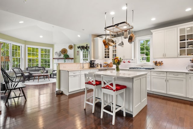 100 Pembroke Ter, Glastonbury, CT 06033 - kitchen featuring backsplash, a kitchen island, white cabinets, and recessed lighting