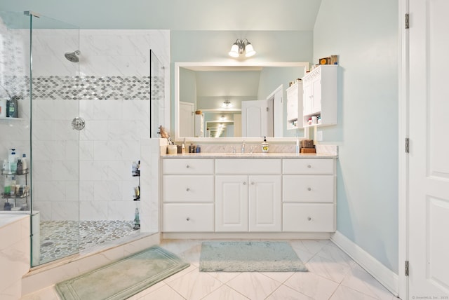 100 Pembroke Ter, Glastonbury, CT 06033 - bathroom with marble look tile flooring, a stall shower, baseboards, and vanity
