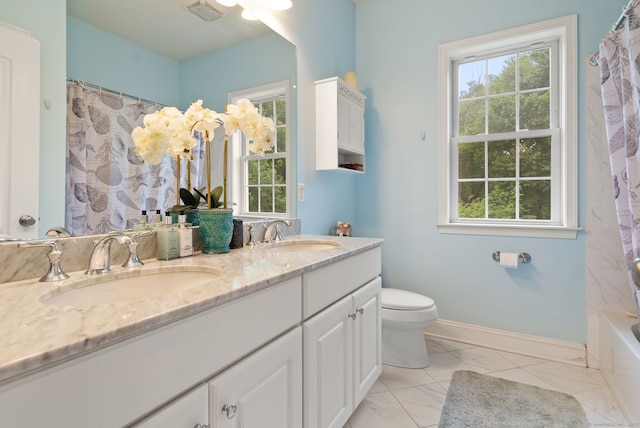 100 Pembroke Ter, Glastonbury, CT 06033 - full bathroom featuring double vanity, toilet, marble finish floors, and baseboards