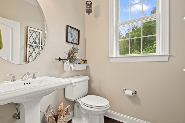 100 Pembroke Ter, Glastonbury, CT 06033 - half bathroom with baseboards, toilet, wood finished floors, and a sink