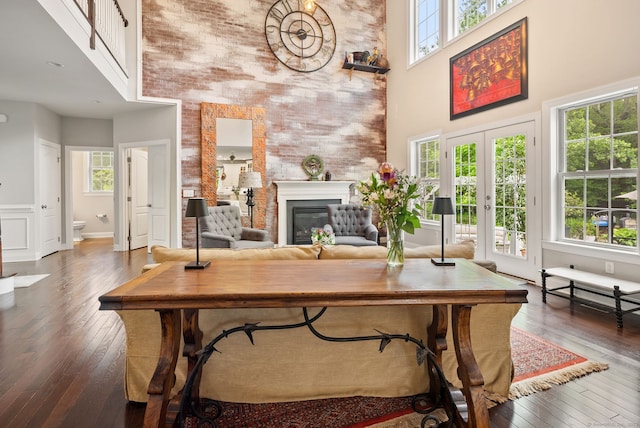 100 Pembroke Ter, Glastonbury, CT 06033 - office space featuring a towering ceiling, healthy amount of natural light, wood-type flooring, a glass covered fireplace, and french doors