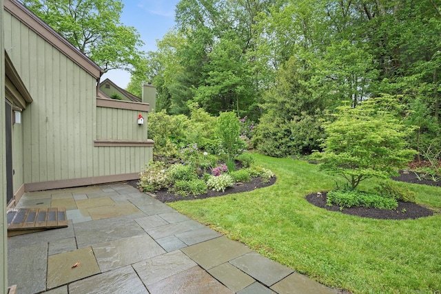 738 Heritage Vlg Unit B, Southbury, CT 06488 - view of grassy yard featuring a patio
