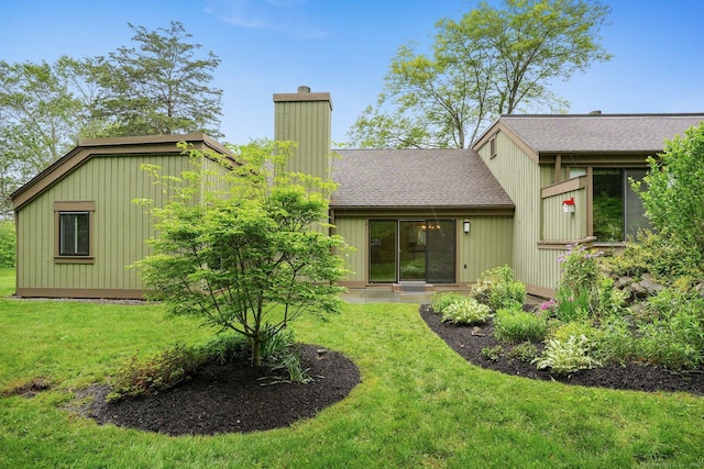 738 Heritage Vlg Unit B, Southbury, CT 06488 - rear view of property with a chimney, a lawn, and a shingled roof