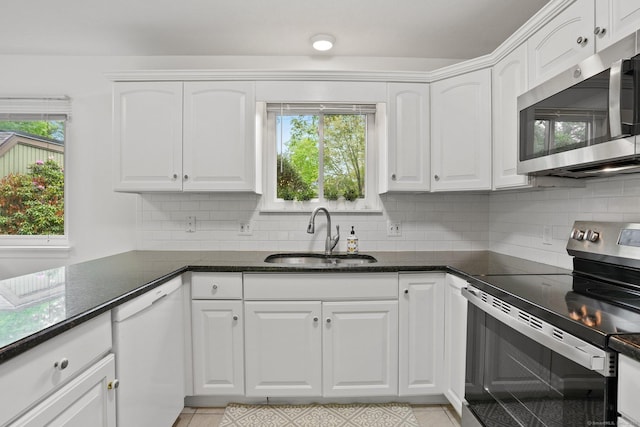 738 Heritage Vlg Unit B, Southbury, CT 06488 - kitchen featuring appliances with stainless steel finishes, a sink, and white cabinets