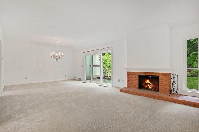 738 Heritage Vlg Unit B, Southbury, CT 06488 - unfurnished living room with a brick fireplace, carpet floors, a chandelier, plenty of natural light, and vaulted ceiling