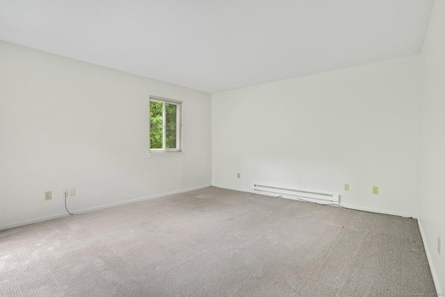 738 Heritage Vlg Unit B, Southbury, CT 06488 - carpeted empty room with a baseboard radiator and baseboards
