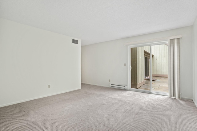 738 Heritage Vlg Unit B, Southbury, CT 06488 - carpeted empty room featuring a baseboard heating unit and baseboards