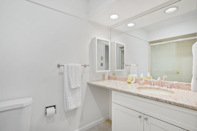 738 Heritage Vlg Unit B, Southbury, CT 06488 - full bathroom with vanity, toilet, a shower with door, baseboards, and recessed lighting