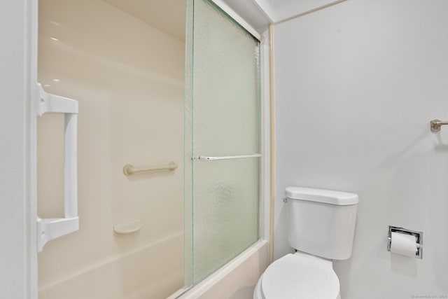 738 Heritage Vlg Unit B, Southbury, CT 06488 - bathroom with toilet and shower / bath combination with glass door