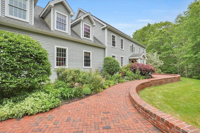 15 Surrey Ridge Rd, Killingworth, CT 06419 - view of home's exterior featuring a lawn and roof with shingles
